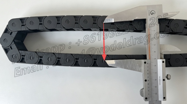 Measuring the bending height and radius profile of a premium‑grade coiled PA66 small drag chain using a vernier caliper