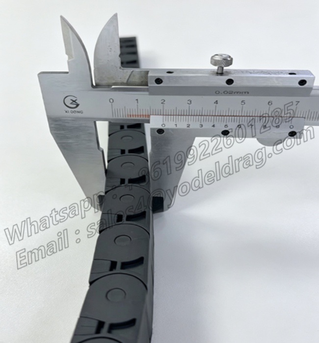 Measuring the outer height of a china manufacturer black 15&times;20mm PA66 small drag chain link using a precision vernier caliper